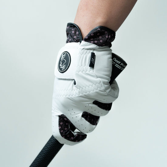 Alpine Golf Hana Edition - Minimalist floral print golf glove in pink and black, crafted with moisture-wicking technology and soft Cabretta leather for professional grip.